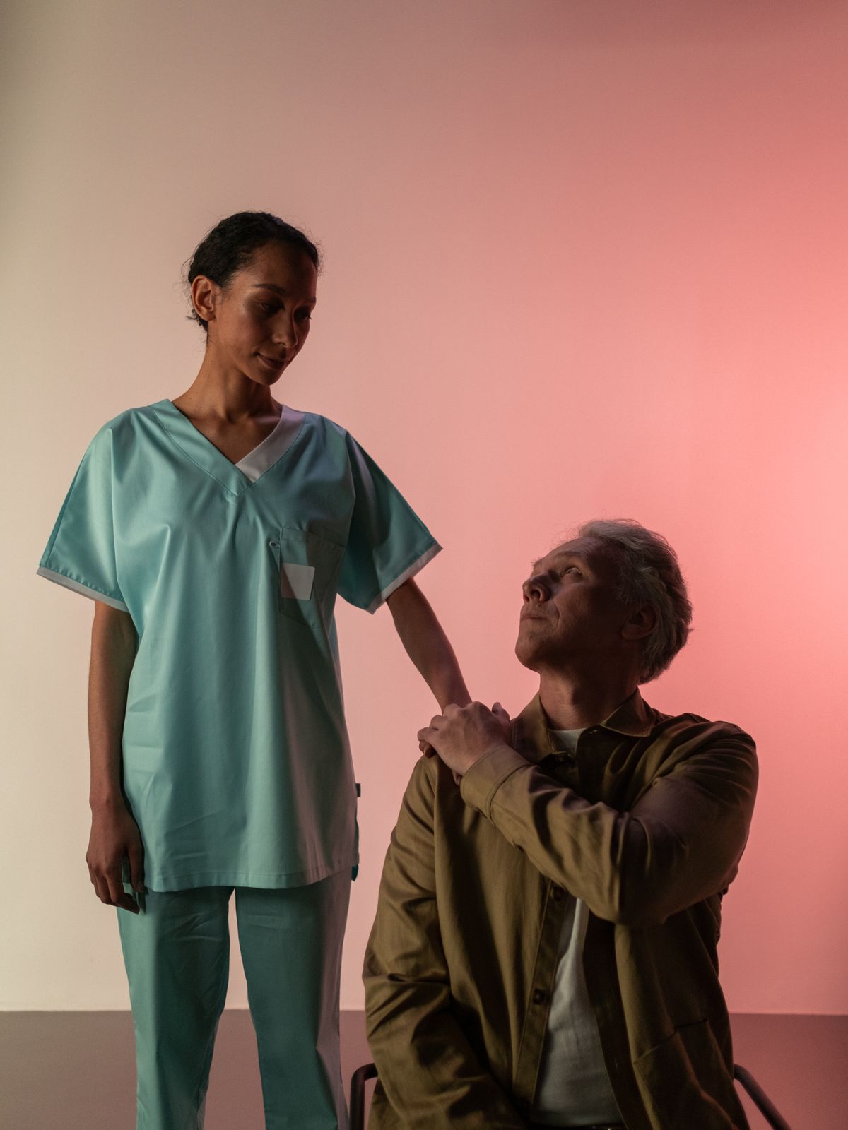 A Magnet nurse comforting an elderly patient